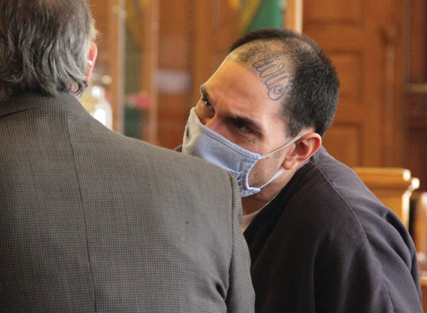 Che J. Salazar speaks with his attorney Richard Davies during an appearance in Jefferson County Superior Court.