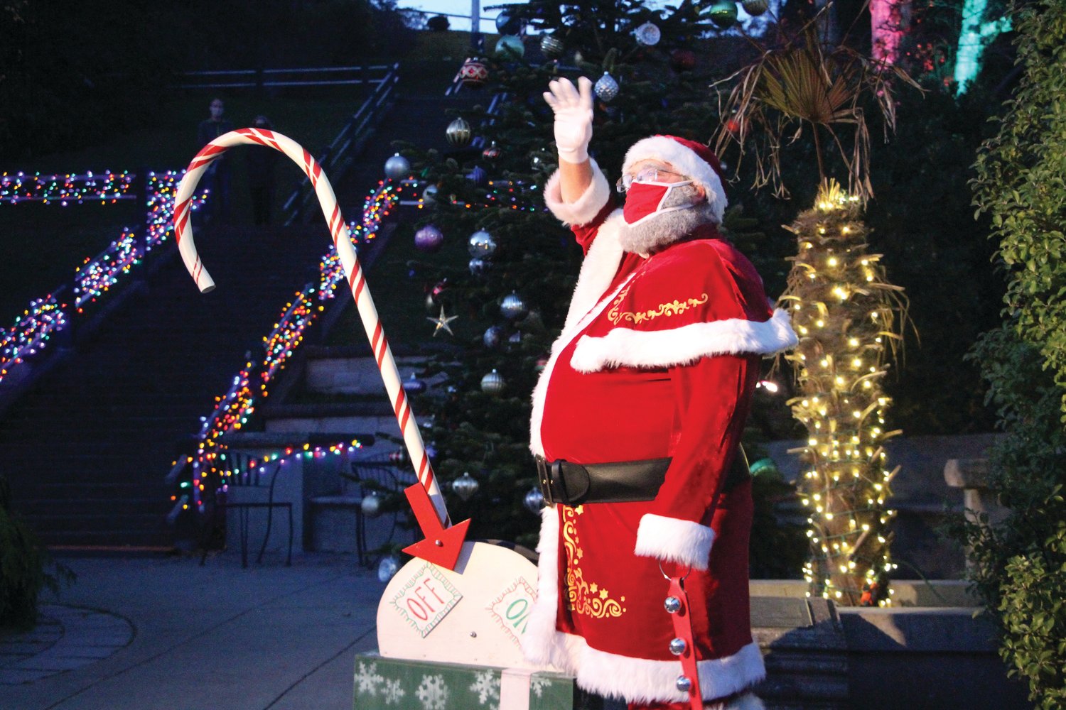 Santa waves to viewers at home moments before pulling the lever to light the tree at Haller Fountain.