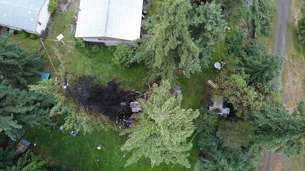 An aerial photo shows the blast scene in Port Hadlock that left two people with injuries after an explosion Tuesday night.