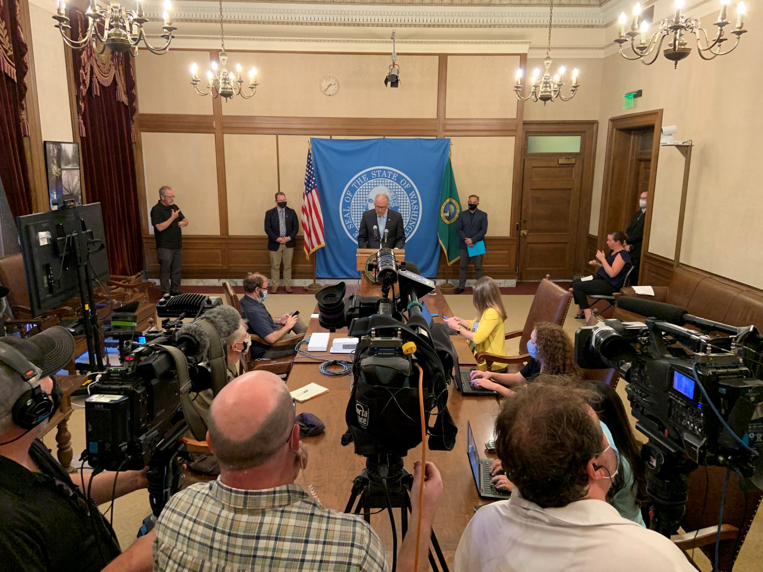 Gov. Jay Inslee announces a statewide requirement for public school employees to get vaccinations against COVID-19 at a press conference Wednesday.