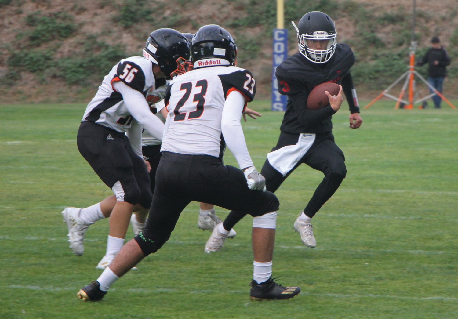 Rivals quarterback Cash Holmes evades defenders as he runs to the sideline for a first down. The Port Townsend High School sophomore scored a 10-yard touchdown run in the first quarter of the game.