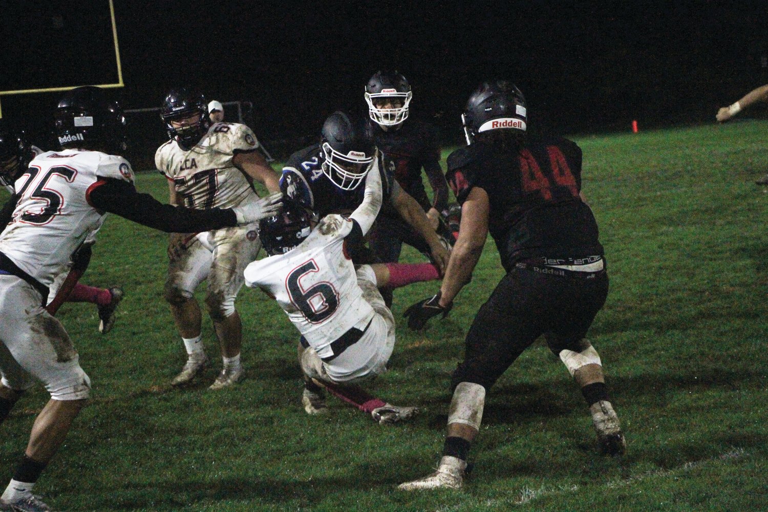 Anson Jones, the Rivals’ senior fullback, trucks an opponent to gain a first down. Jones had 27 rushing yards and a touchdown on the night.