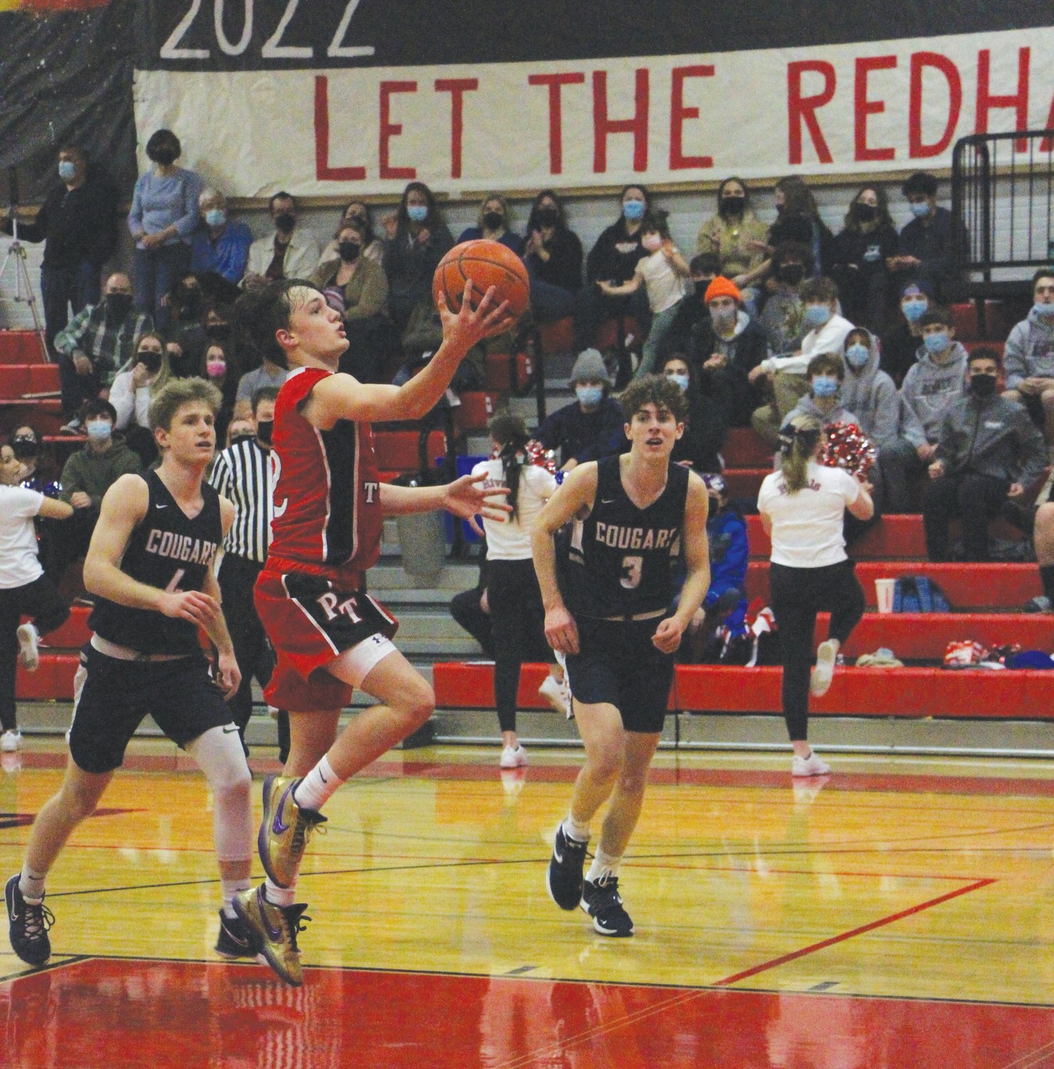 Sophomore guard Brody Moore scores a fast-break layup in the second half for the Rivals.