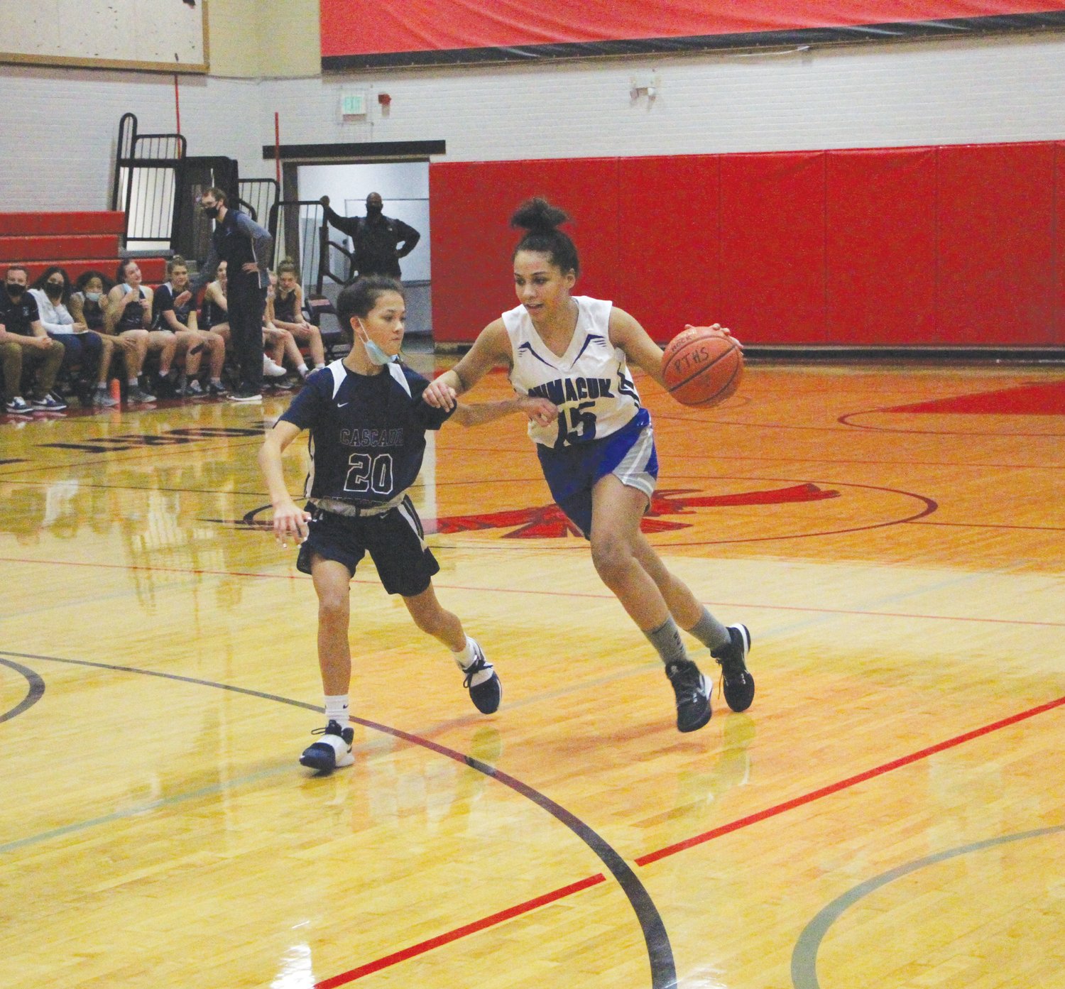 EJ junior Madison Harris drives inside during second-half action against the Cougars.
