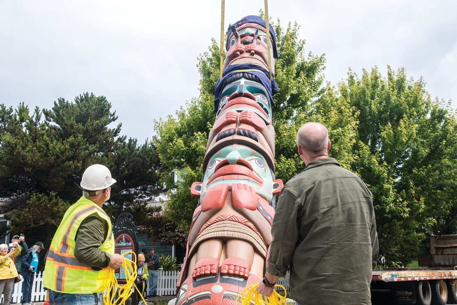 Carpenter Dale Faulstich designed the totem pole, erected in June 2019, which features the Supernatural Carpenter, the Spirit of Western Red Cedar, Chetzemoka, and Sentinel Rock, located outside the Northwest Maritime Center.