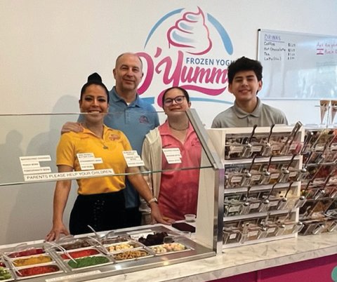 The Olsons pose during the grand re-opening of O’Yummy Frozen Yogurt on Feb. 19 and 20.