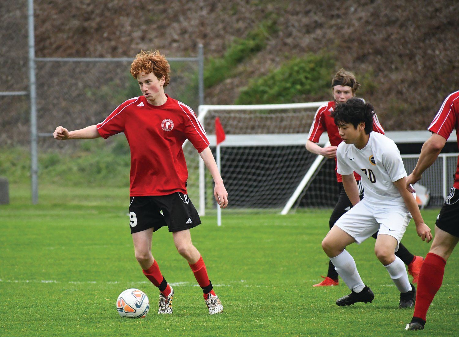 Mark Anderson moves forward with the ball in an East Jefferson Rivals soccer game in the spring.