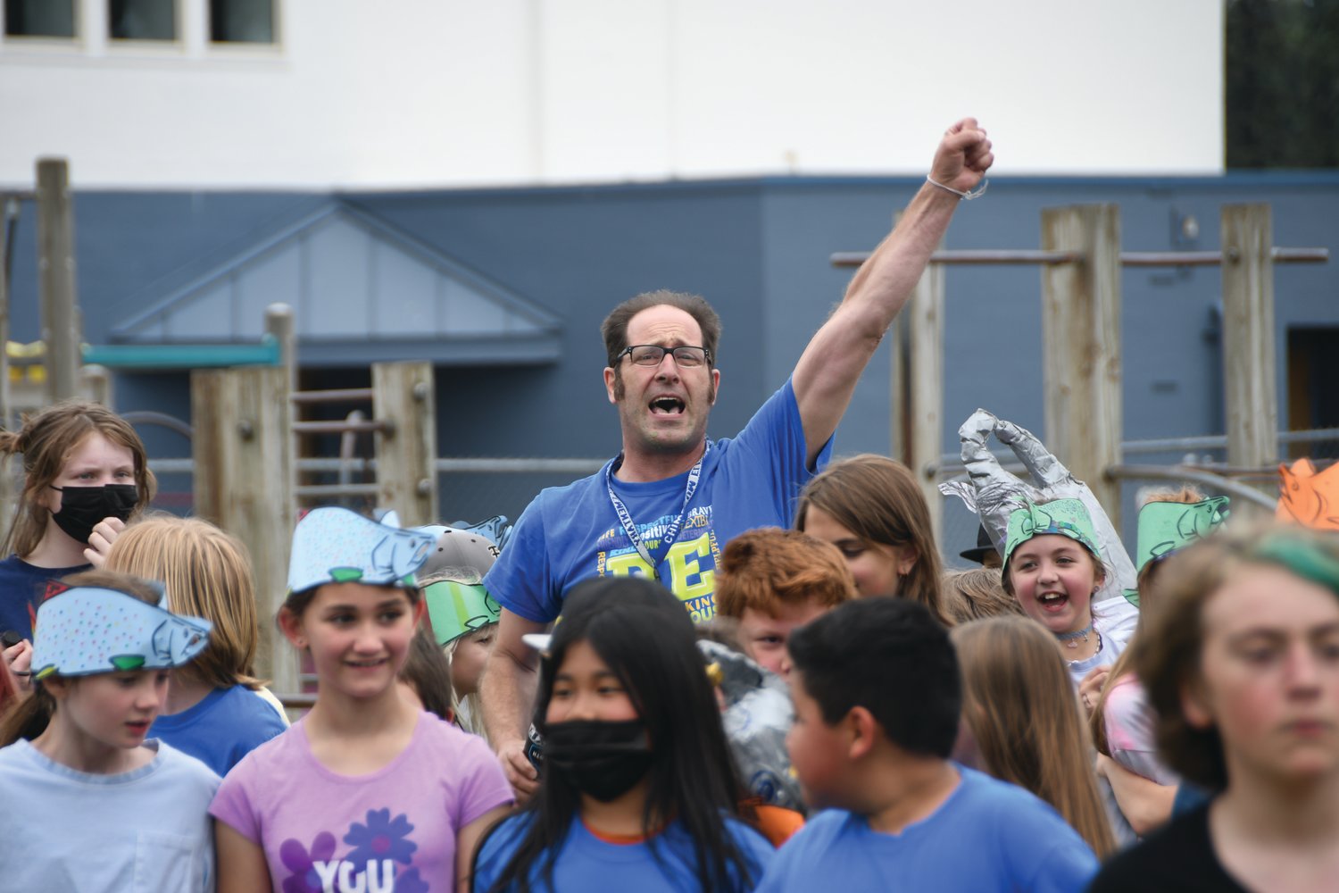 Fourth-grade teacher Matt Orr inspires his class to move onward during the field day event.