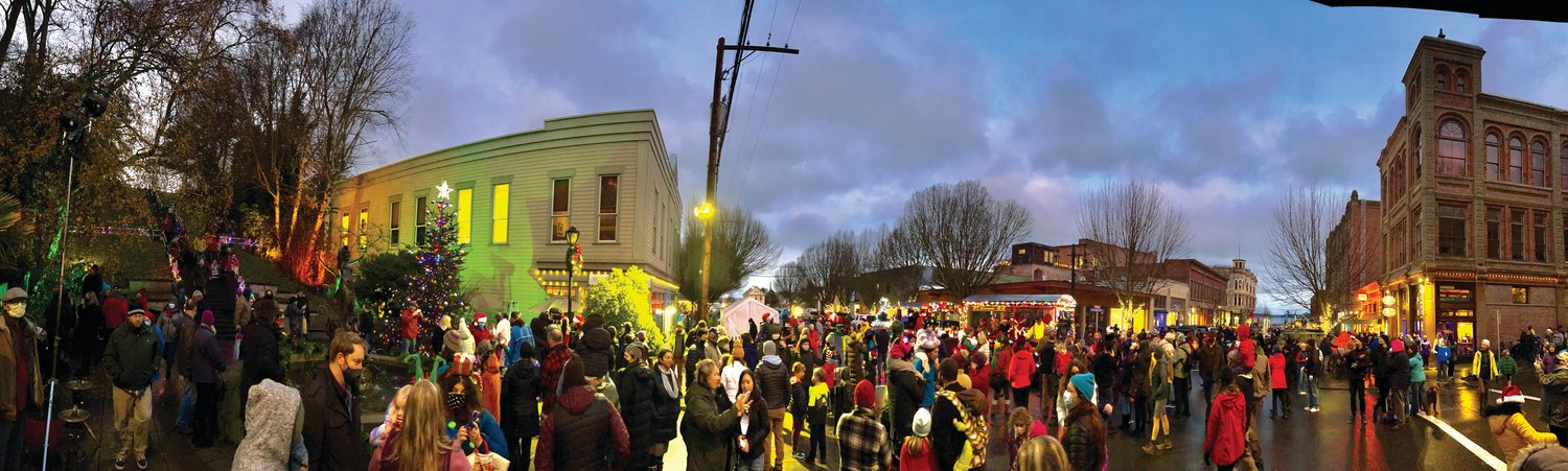 Locals gather for the annual tree-lighting ceremony at the Haller Fountain in downtown Port Townsend.