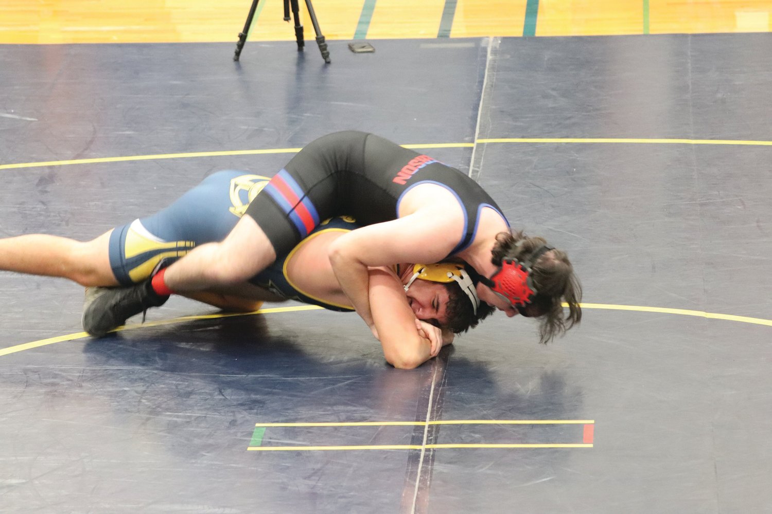 EJ senior Sam Lampert performs a double-leg ride on Ilwaco opponent Christian Olivo in the Forks wrestling tourney over the weekend. Lampert went on to pin his opponent in the second round of the semi-final match.