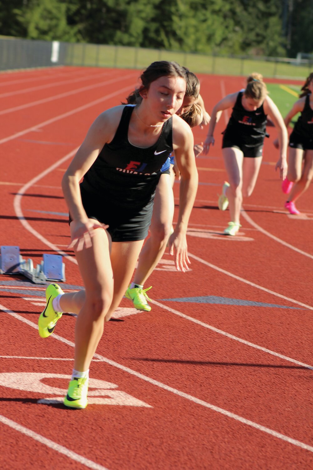 Rivals runner Kaylen Pray launches from the start of the 200-meter race in Silverdale.